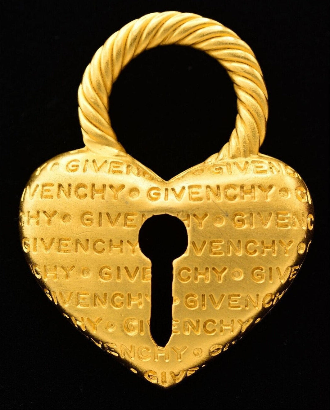 Gold Givenchy padlock on a black background