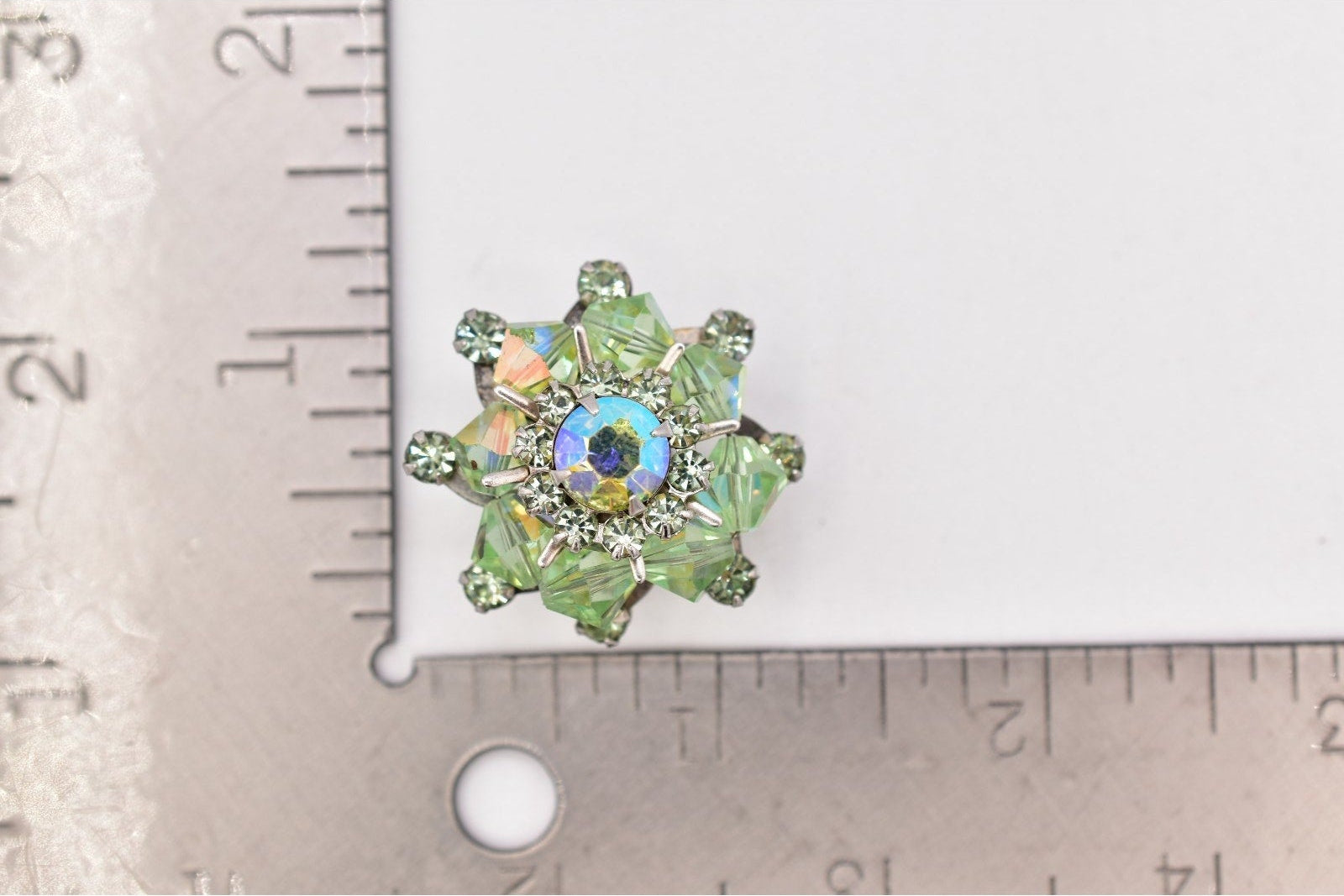 Decorative gemstone on a ruler for scale