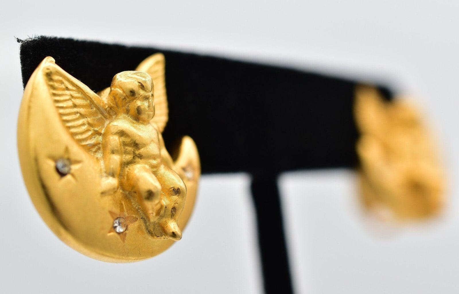 Gold angel emblem on a black background