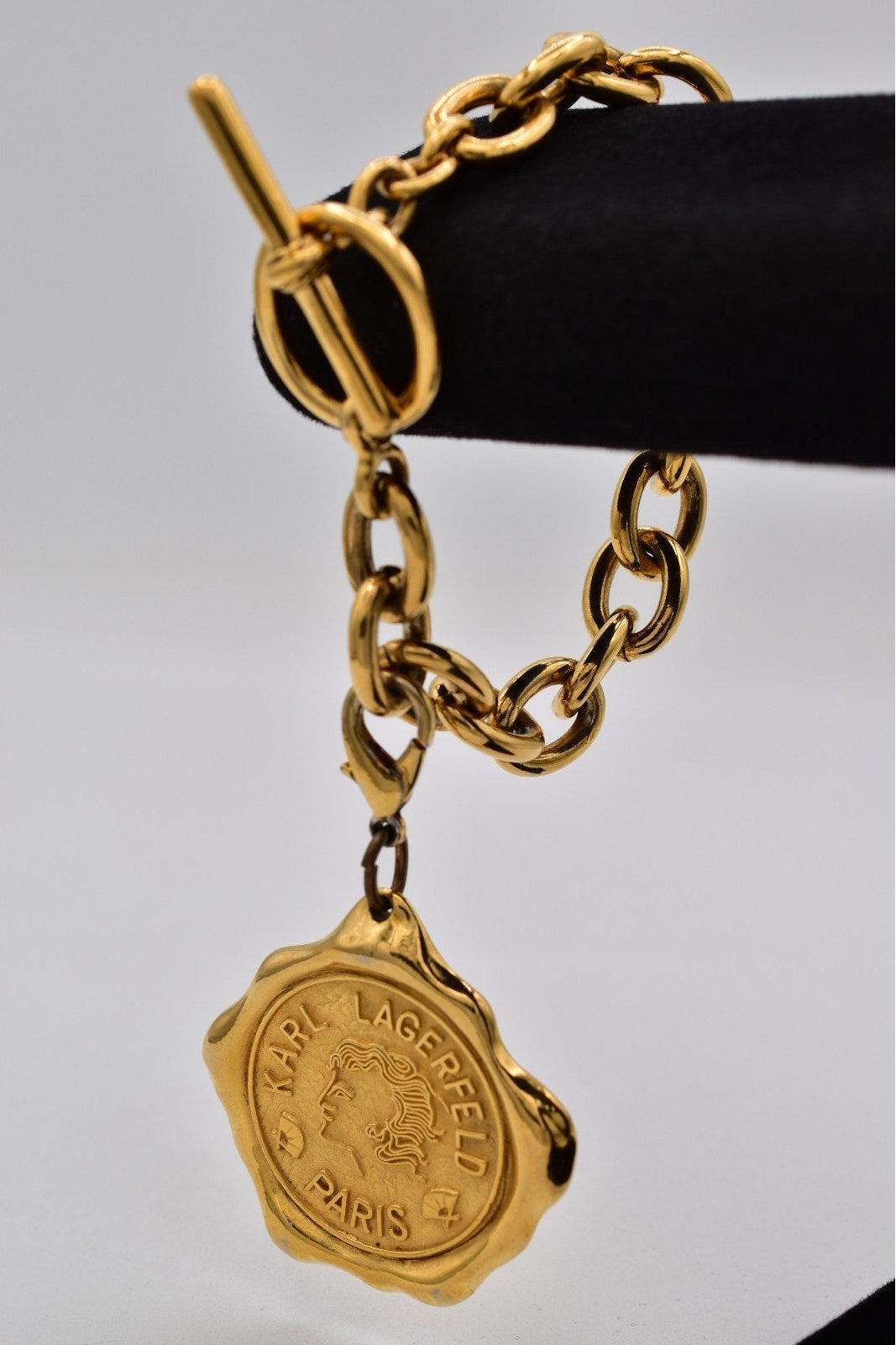 Gold chain belt with a Medallion on a white background