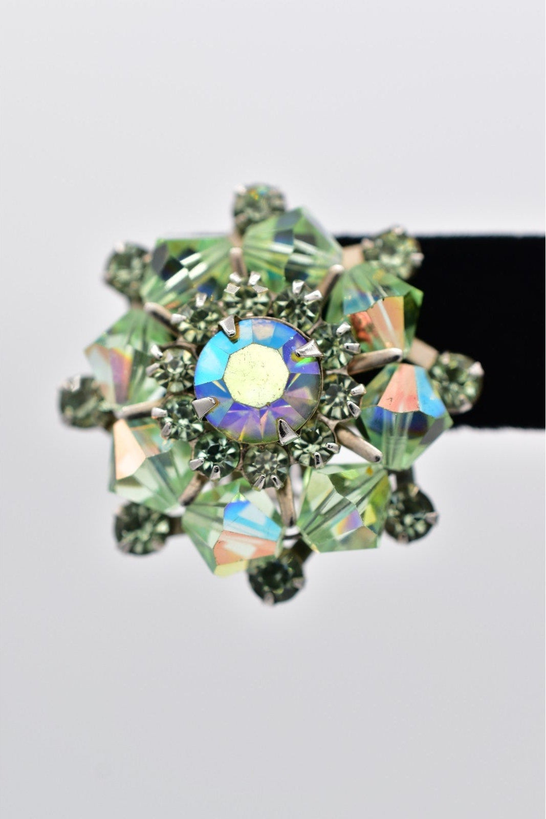 Multicolored gemstone hair clip on a white background