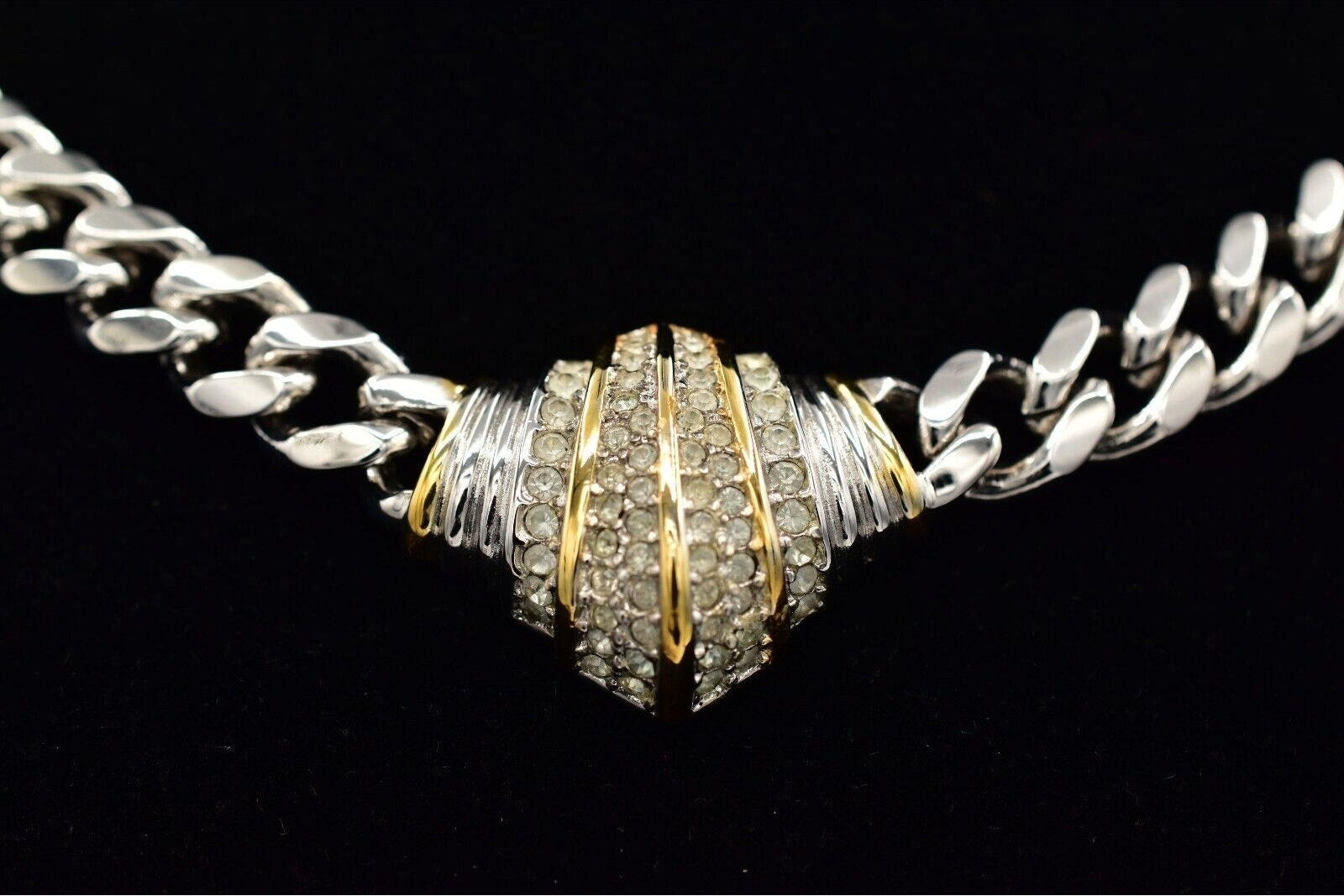 Necklace with a detailed clasp on a black background