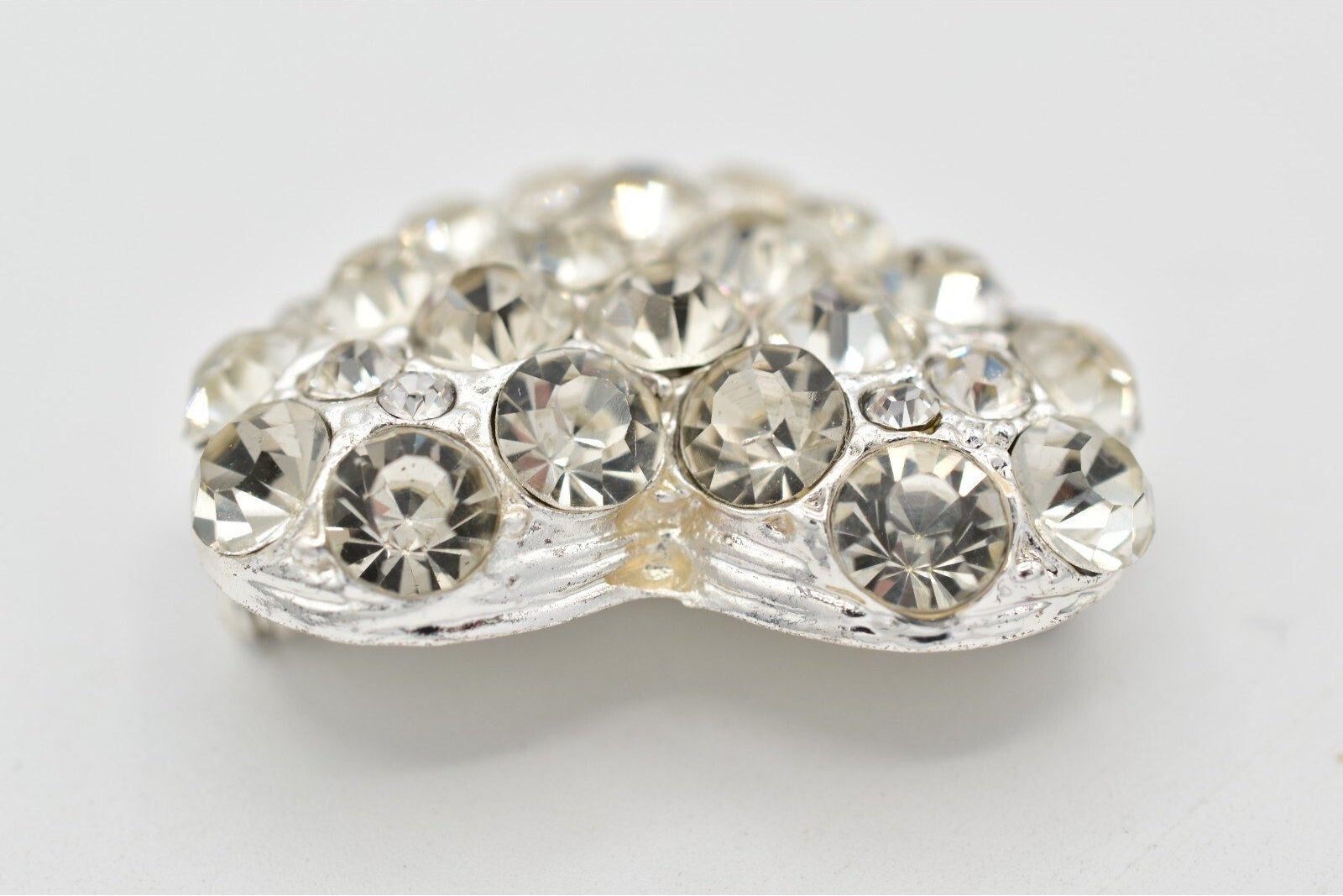 Decorative crystal brooch on a white background